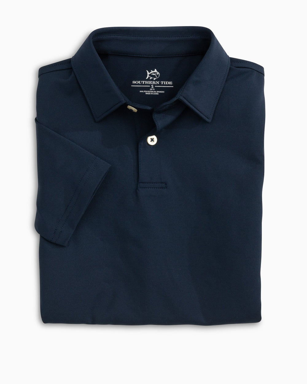The folded view of the Boys Driver Performance Polo Shirt by Southern Tide - True Navy