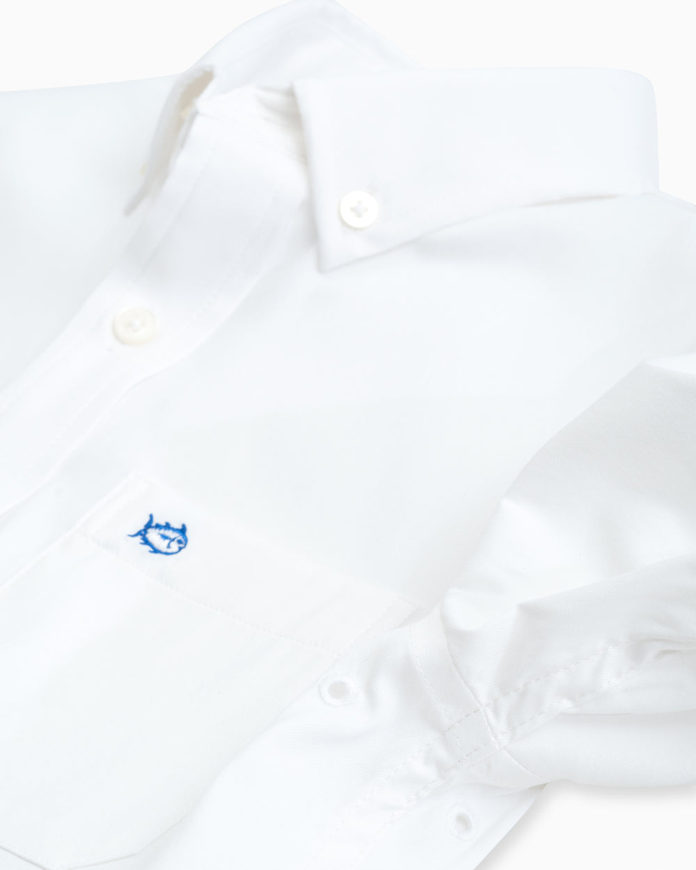 The eyelet of the Boys Solid Intercoastal Button Down Shirt by Southern Tide - Classic White