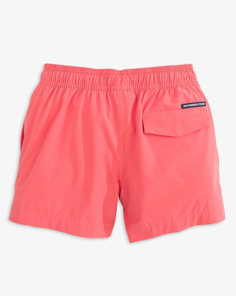 The back view of the Southern Tide Boys Solid Swim Truck 2 0 by Southern Tide - Sunkist Coral