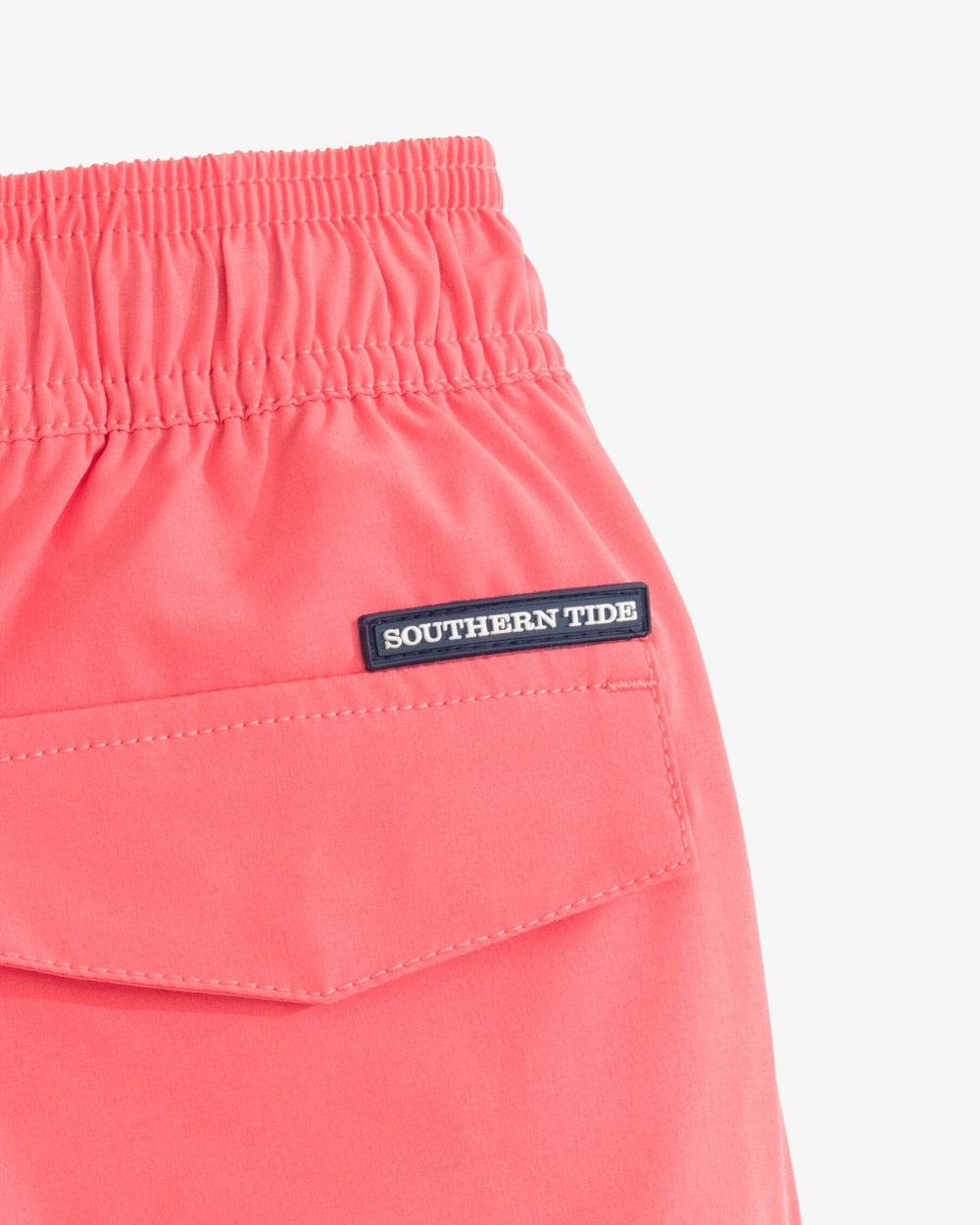 The detail view of the Southern Tide Boys Solid Swim Truck 2 0 by Southern Tide - Sunkist Coral