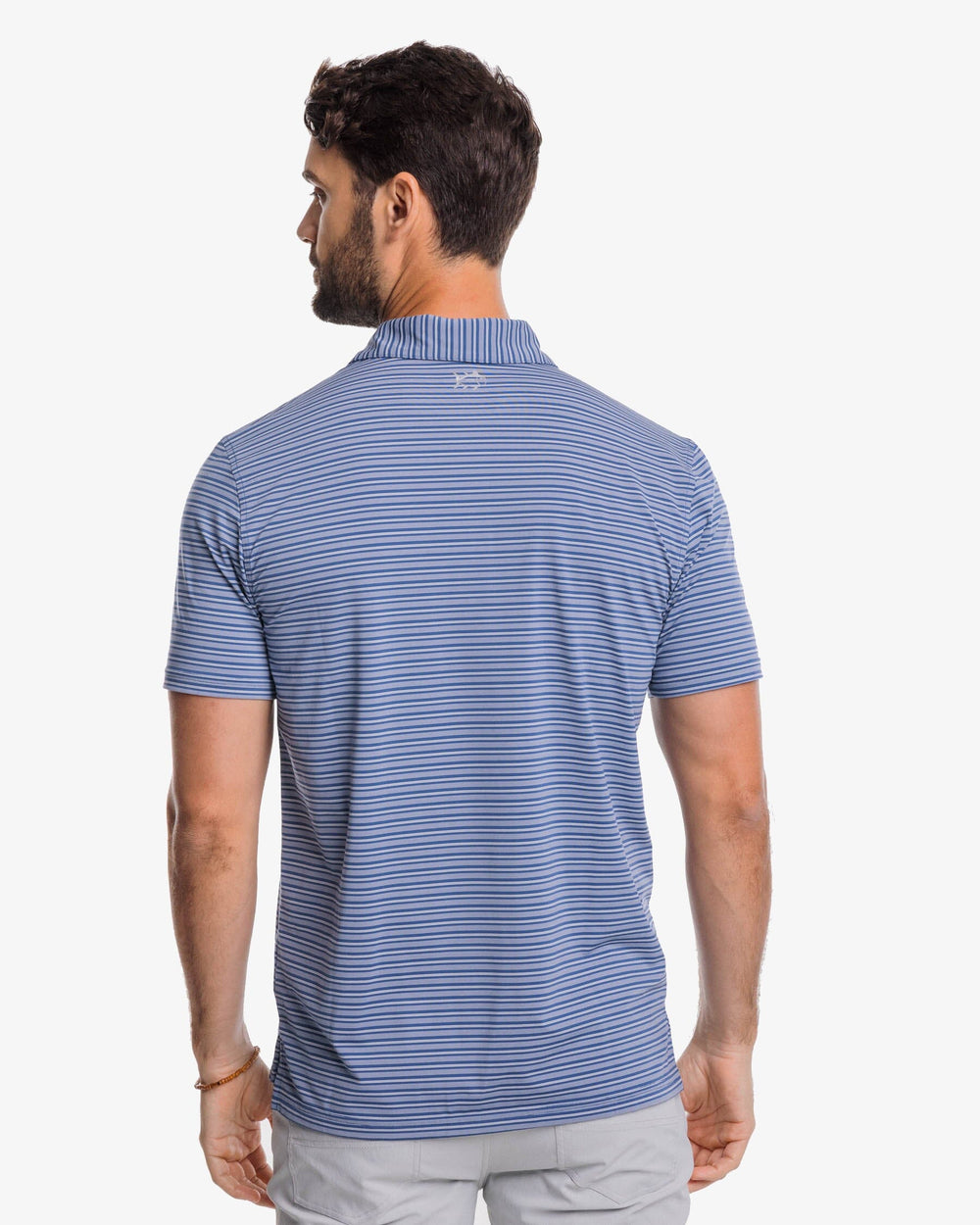 The back view of the Southern Tide brrr°®-eeze Bowen Stripe Performance Polo Shirt by Southern Tide - Aged Denim