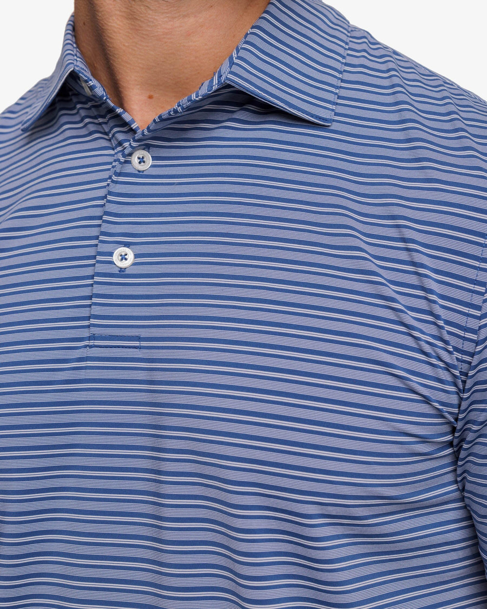 The detail view of the Southern Tide brrr°®-eeze Bowen Stripe Performance Polo Shirt by Southern Tide - Aged Denim