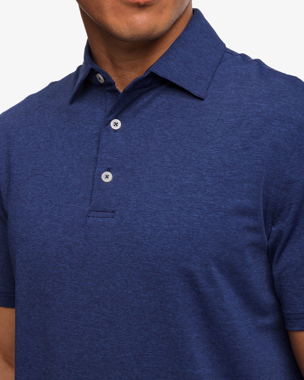The detail view of the brrr°®-eeze Heather Performance Polo Shirt by Southern Tide - Heather Nautical Navy