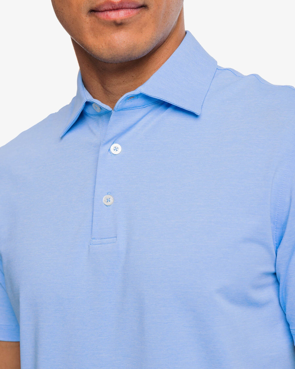 The detail view of the brrr°®-eeze Heather Performance Polo Shirt by Southern Tide - Heather Ocean Channel