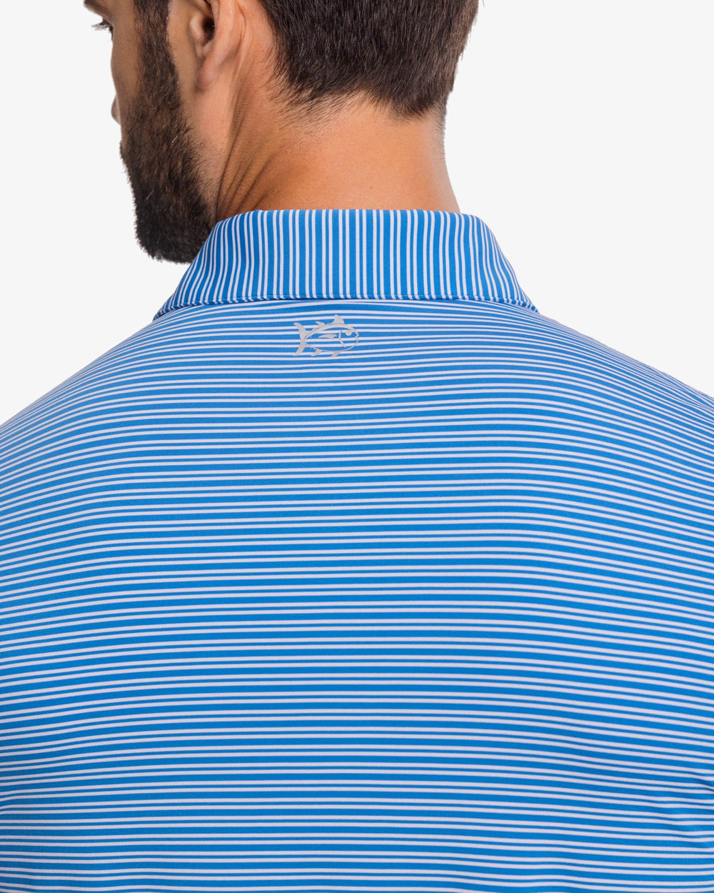 The detail view of the Southern Tide brrr-eeze Millwood Stripe Performance Polo Shirt by Southern Tide - Atlantic Blue