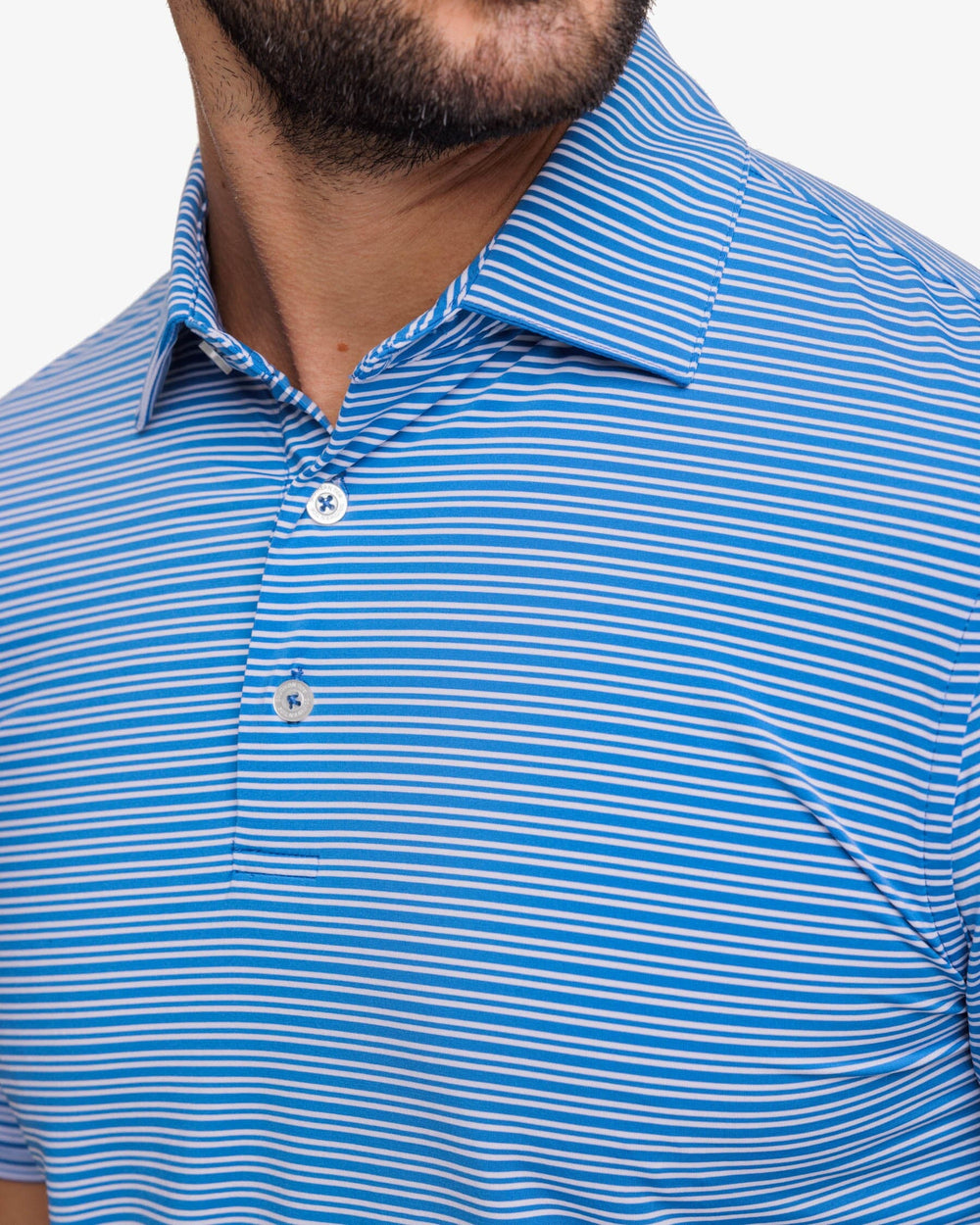 The front detail view of the Southern Tide brrr-eeze Millwood Stripe Performance Polo Shirt by Southern Tide - Atlantic Blue