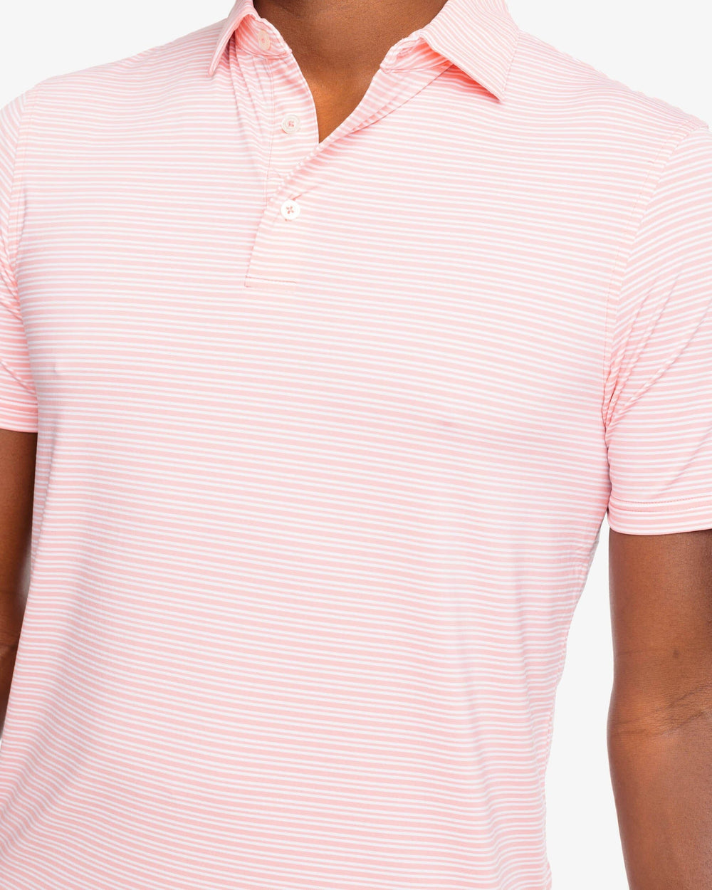 The detail view of the Southern Tide brrr-eeze Millwood Stripe Performance Polo Shirt by Southern Tide - Flamingo Pink