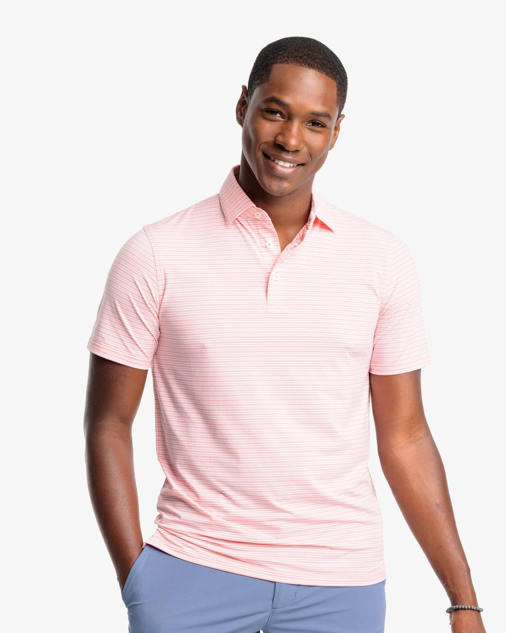 The front view of the Southern Tide brrr-eeze Millwood Stripe Performance Polo Shirt by Southern Tide - Flamingo Pink
