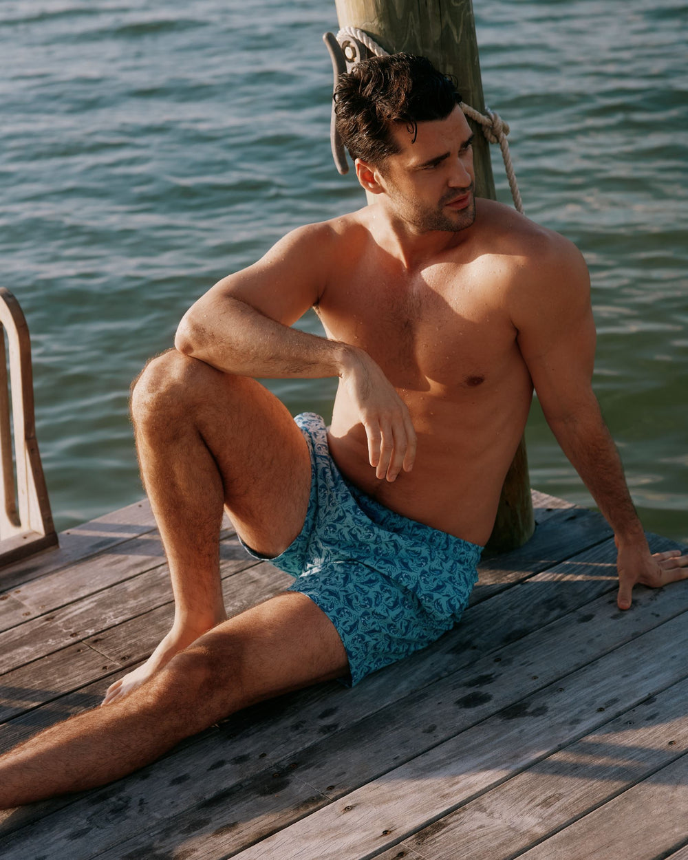 The lifestyle view of the Southern Tide Catch You Later Swim Trunk by Southern Tide - Turquoise Sea