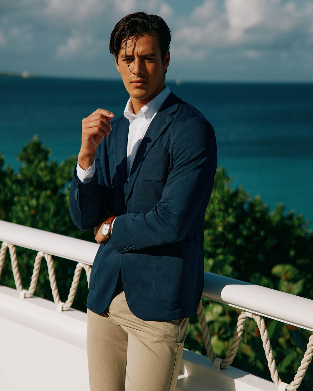 The spring lifestyle view of the Men's Charleston Navy Blazer by Southern Tide - Navy