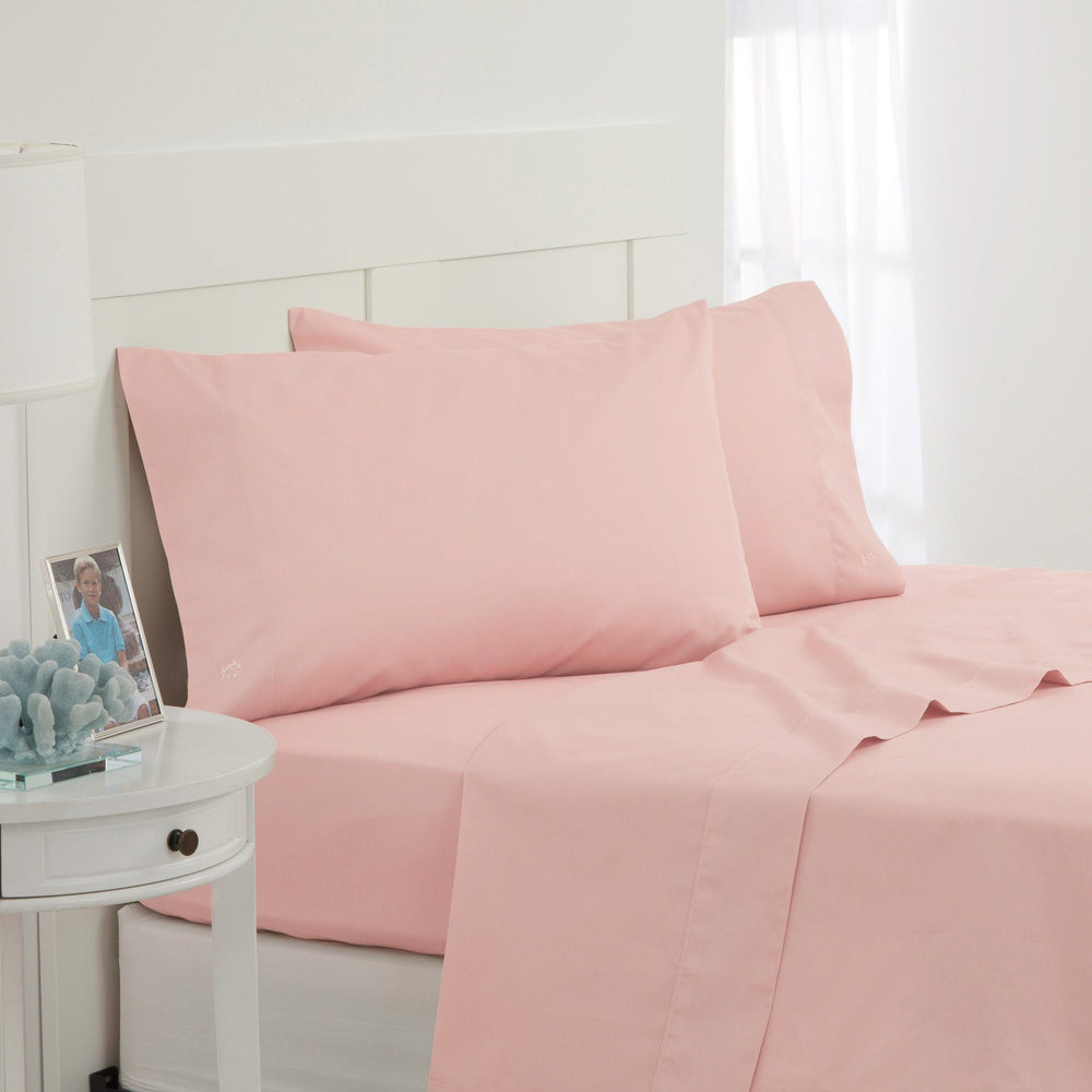 The angle front view of the Southern Tide Cotton Twill Sheet Set by Southern Tide - Seashell Pink