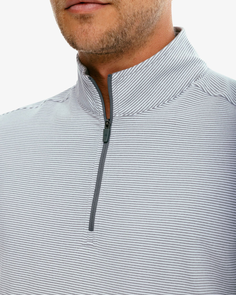The detail of the Men's Cruiser Heather Micro Striped Performance Quarter Zip Pullover by Southern Tide - Heather Steel Grey