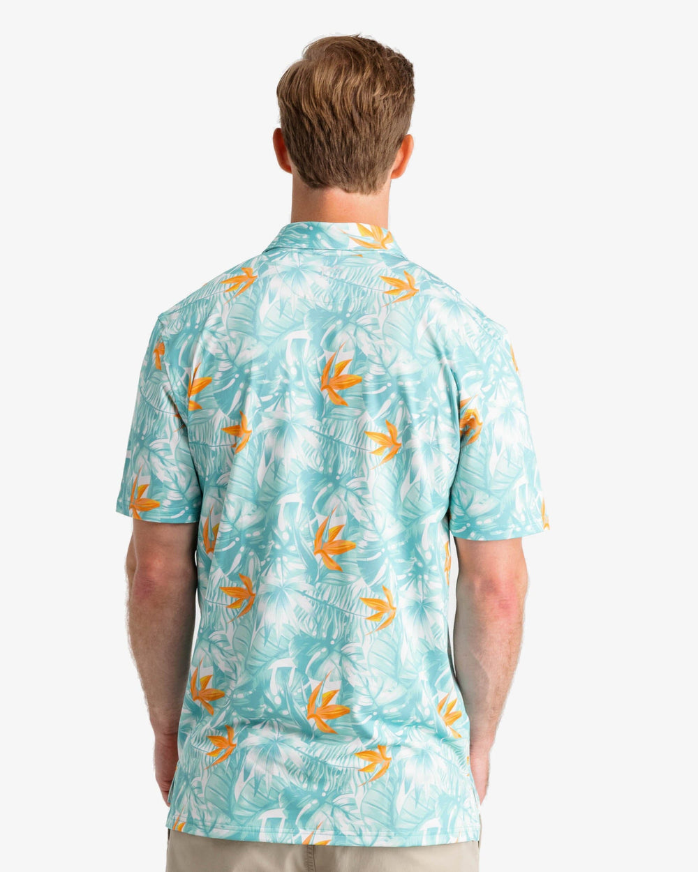 The back view of the Southern Tide Driver Monstera Palm Pring Performance Polo Shirt by Southern Tide - Cloud White