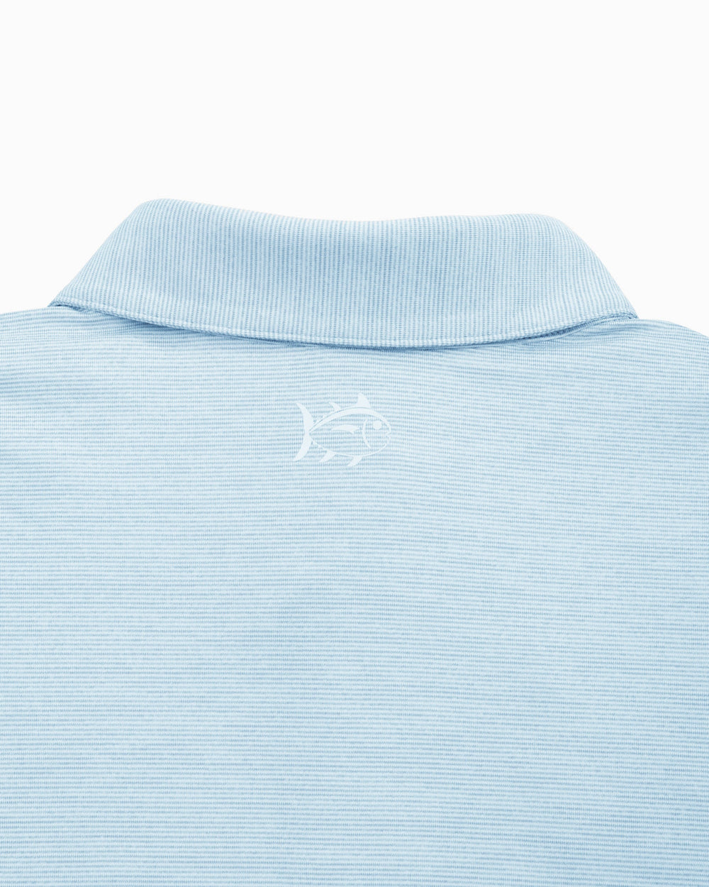 The yoke of the UNC Tar Heels Driver Spacedye Performance Polo Shirt by Southern Tide - Rush Blue