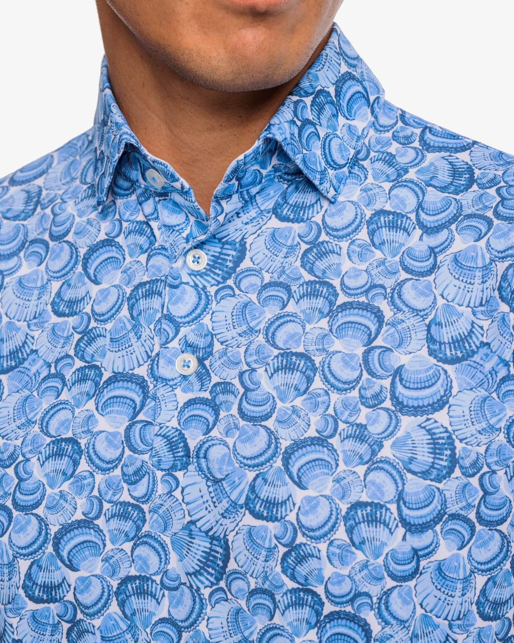 The detail view of the Southern Tide Driver Sunday Shellies Performance Polo Shirt by Southern Tide - Classic White