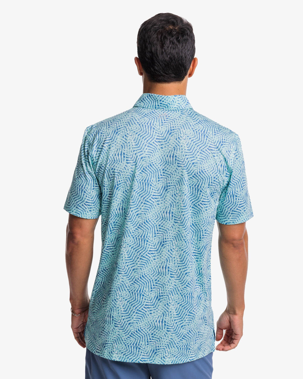 The back view of the Southern Tide Driver Vibin Palm Print Performance Polo Shirt by Southern Tide - Atlantic Blue
