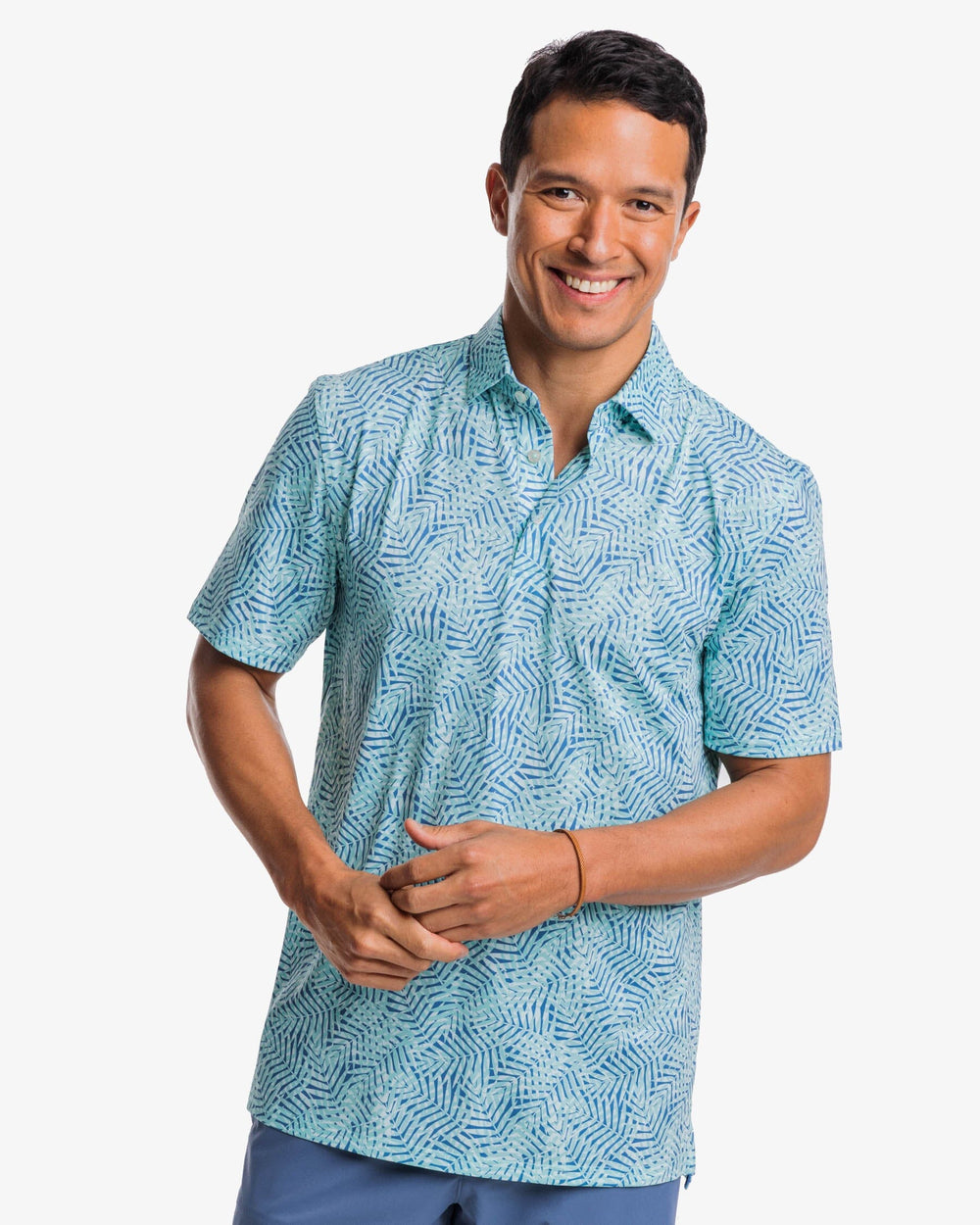 The front view of the Southern Tide Driver Vibin Palm Print Performance Polo Shirt by Southern Tide - Atlantic Blue