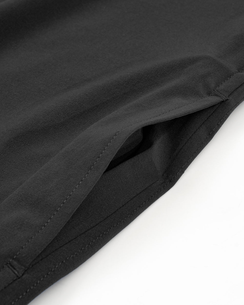 The pocket view of the Women's Black Gameday Dress by Southern Tide - Black