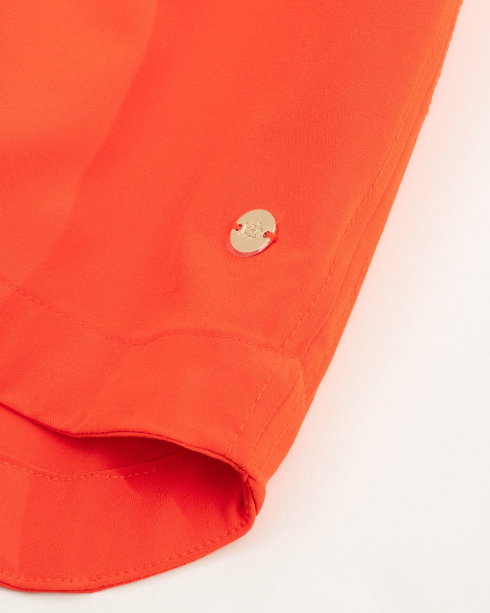 The hem of the Women's Orange Gameday Dress by Southern Tide - EndZone Orange