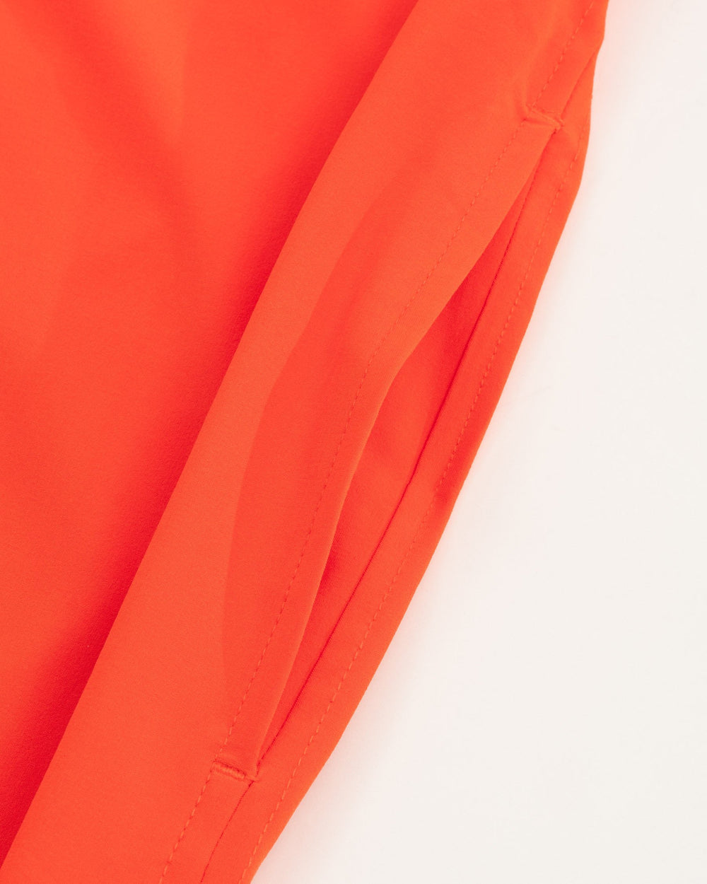The pocket view of the Women's Orange Gameday Dress by Southern Tide - EndZone Orange