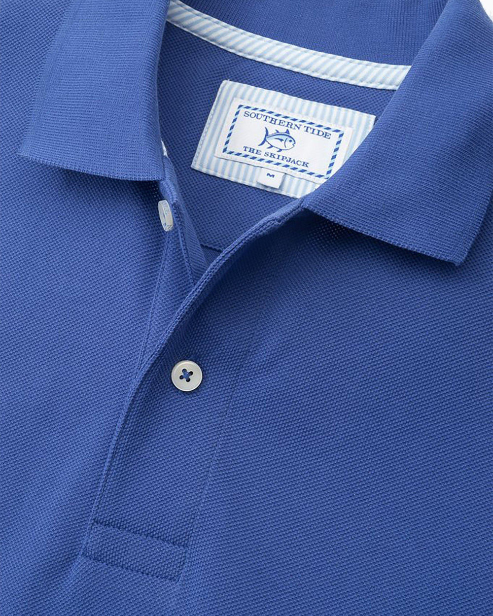 The detail of the Men's Light Blue Florida Gators Pique Polo Shirt by Southern Tide - University Blue