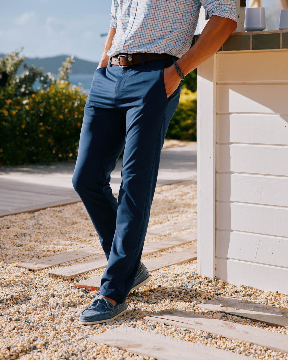 The lifestyle view of the Men's Jack Performance Pant by Southern Tide - True Navy