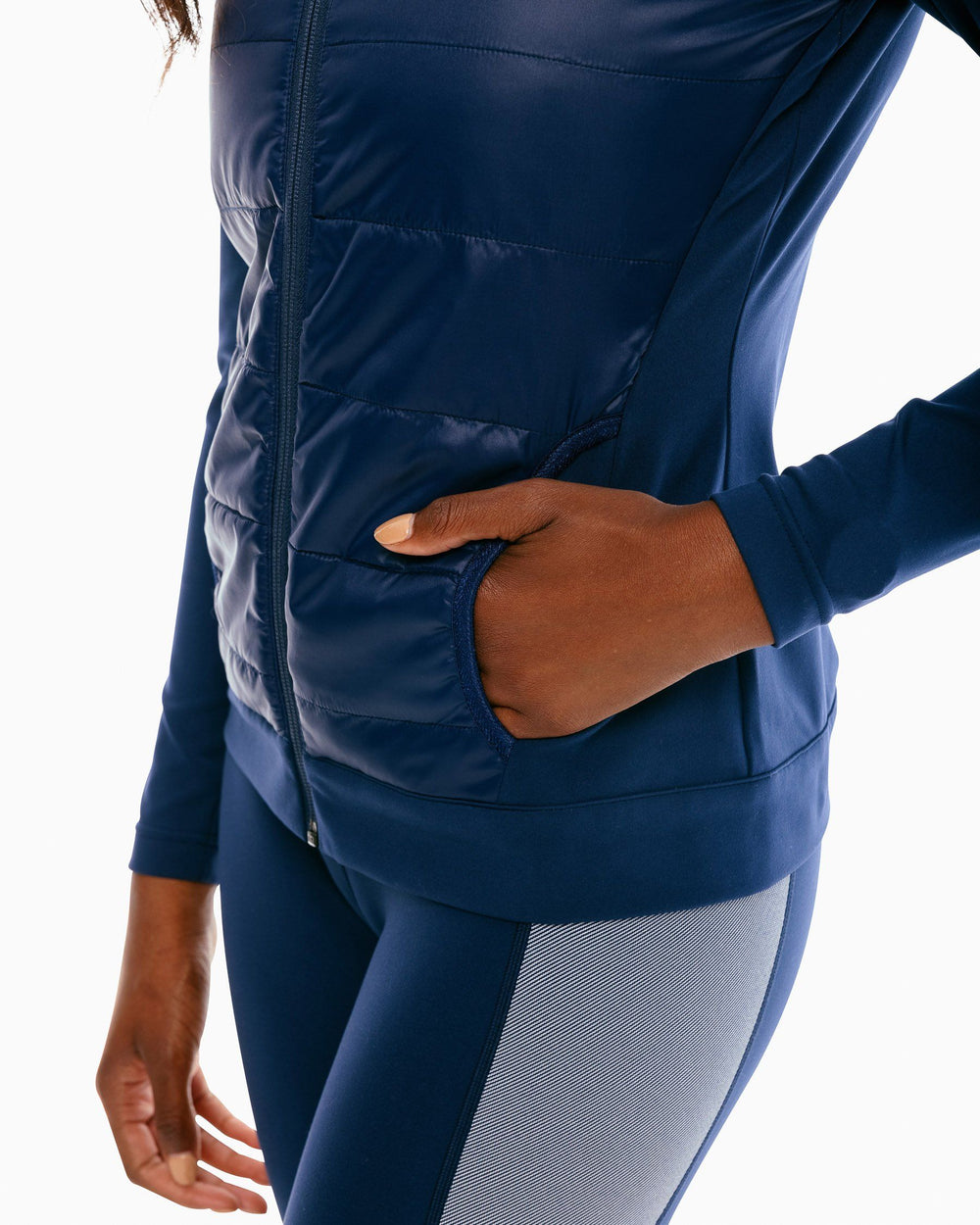 The pocket of the Women's Josette Mixed Media Full Zip Athletic Jacket - True Navy