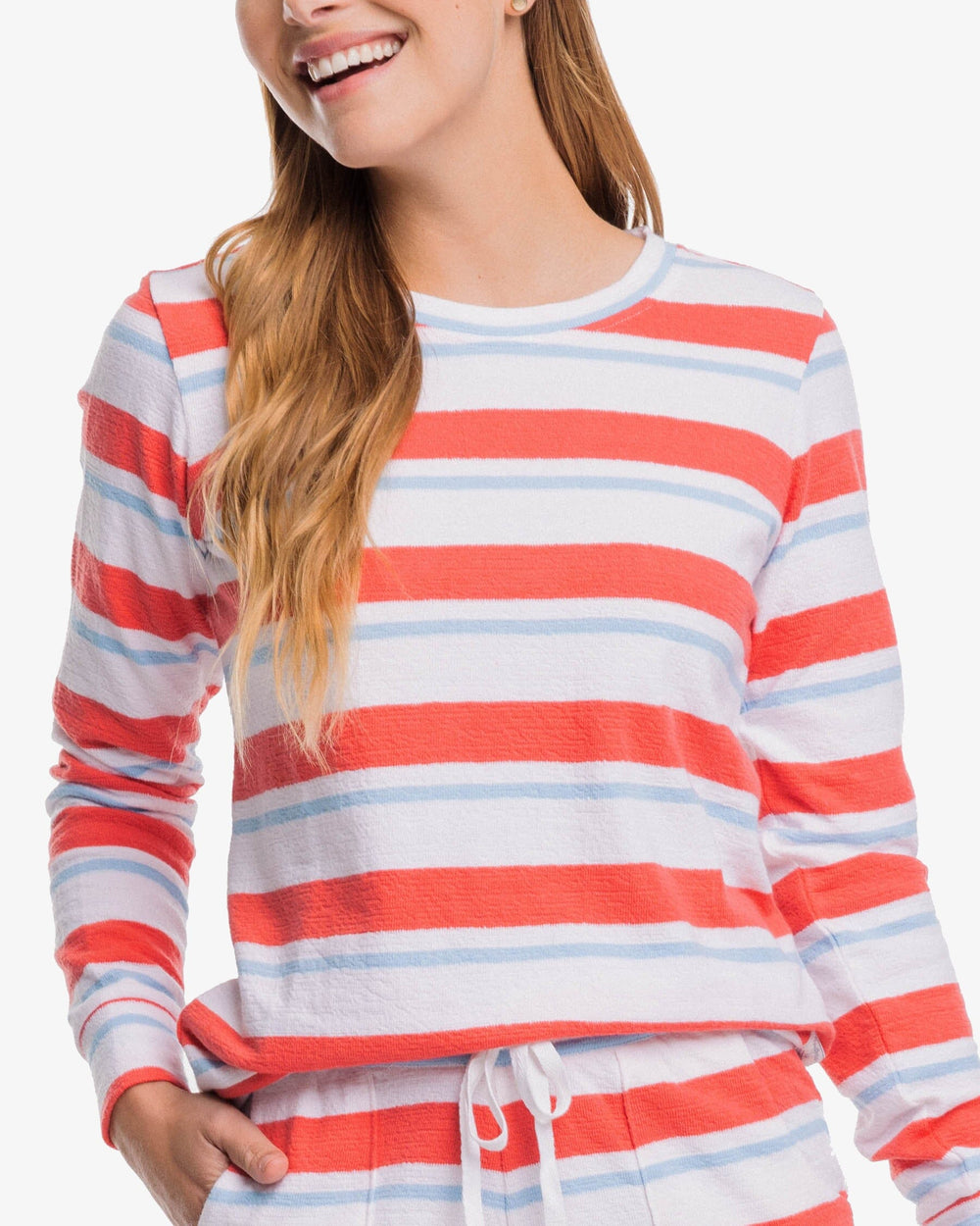 The detail view of the Southern Tide Lana Beach Day Stripe Crew Neck Sweatshirt by Southern Tide - Rosewood Red