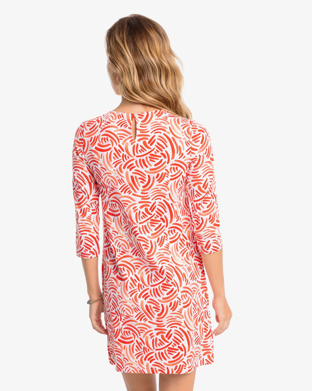 The back view of the Southern Tide Leila Watercolor Whirl Printed Performance Dress by Southern Tide - Flamingo Pink