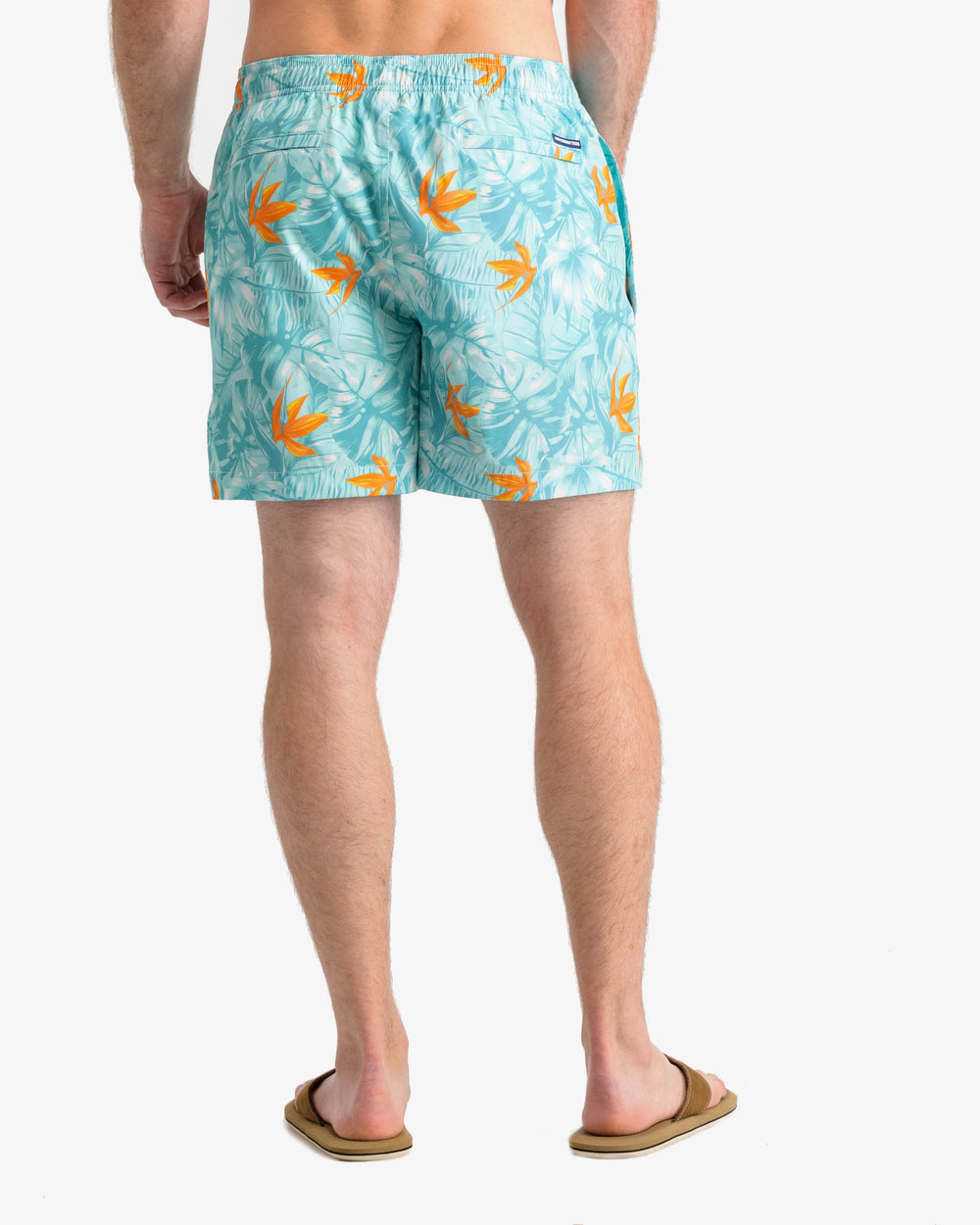 The back view of the Southern Tide Monstera Palm Swim Trunk by Southern Tide - Baltic Teal