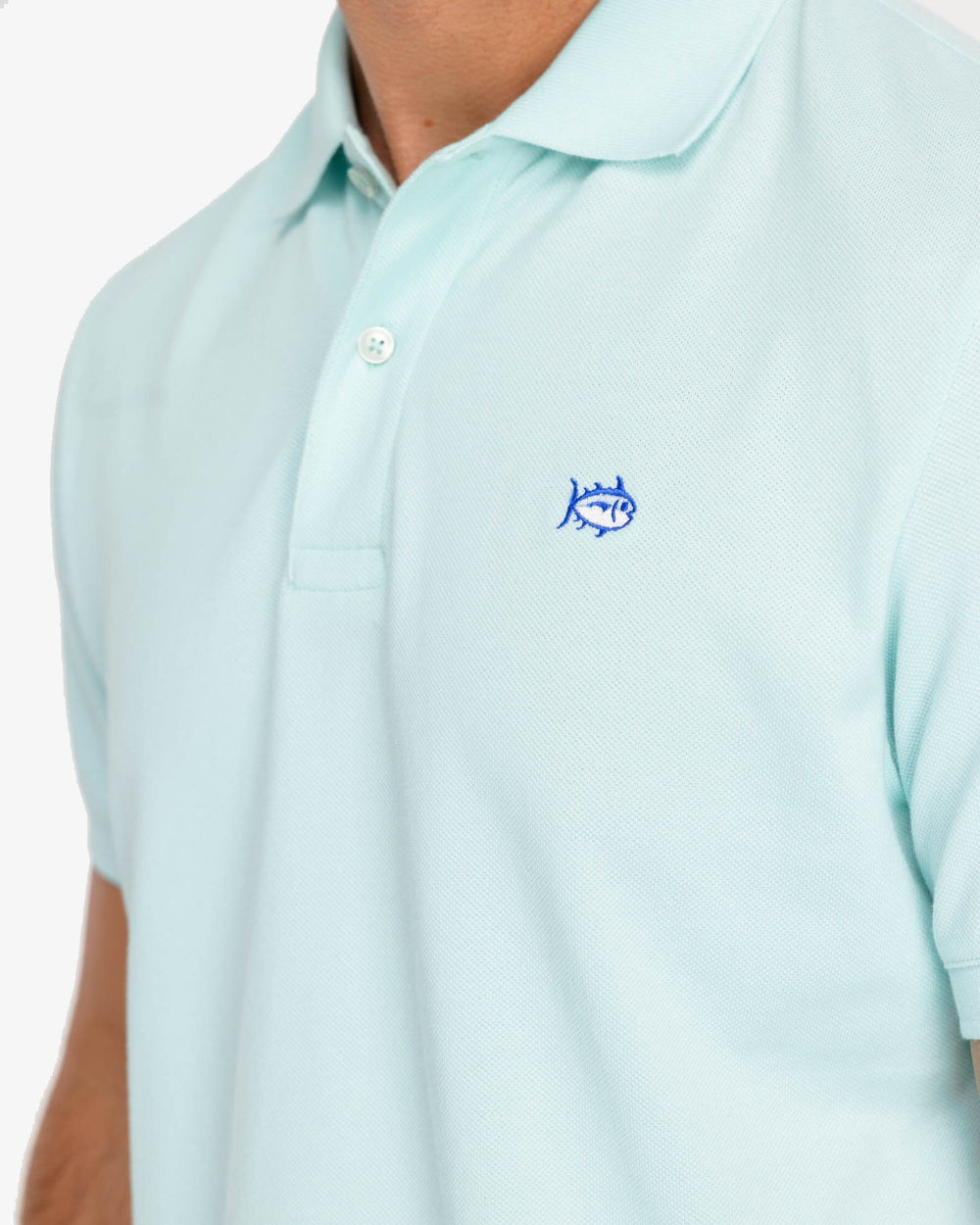 The model detail view of the Men's New Skipjack Polo Shirt by Southern Tide - Baltic Teal