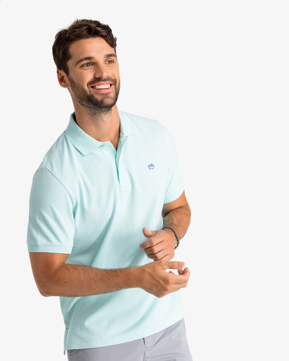The model front view of the Men's New Skipjack Polo Shirt by Southern Tide - Baltic Teal