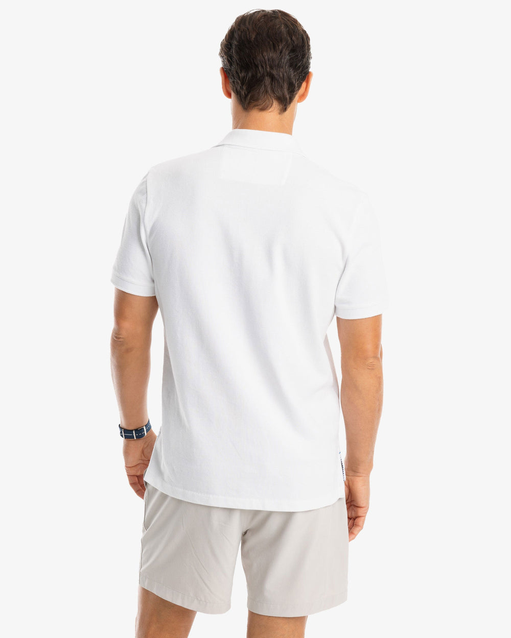 The model back view of the Men's New Skipjack Polo Shirt by Southern Tide - Classic White