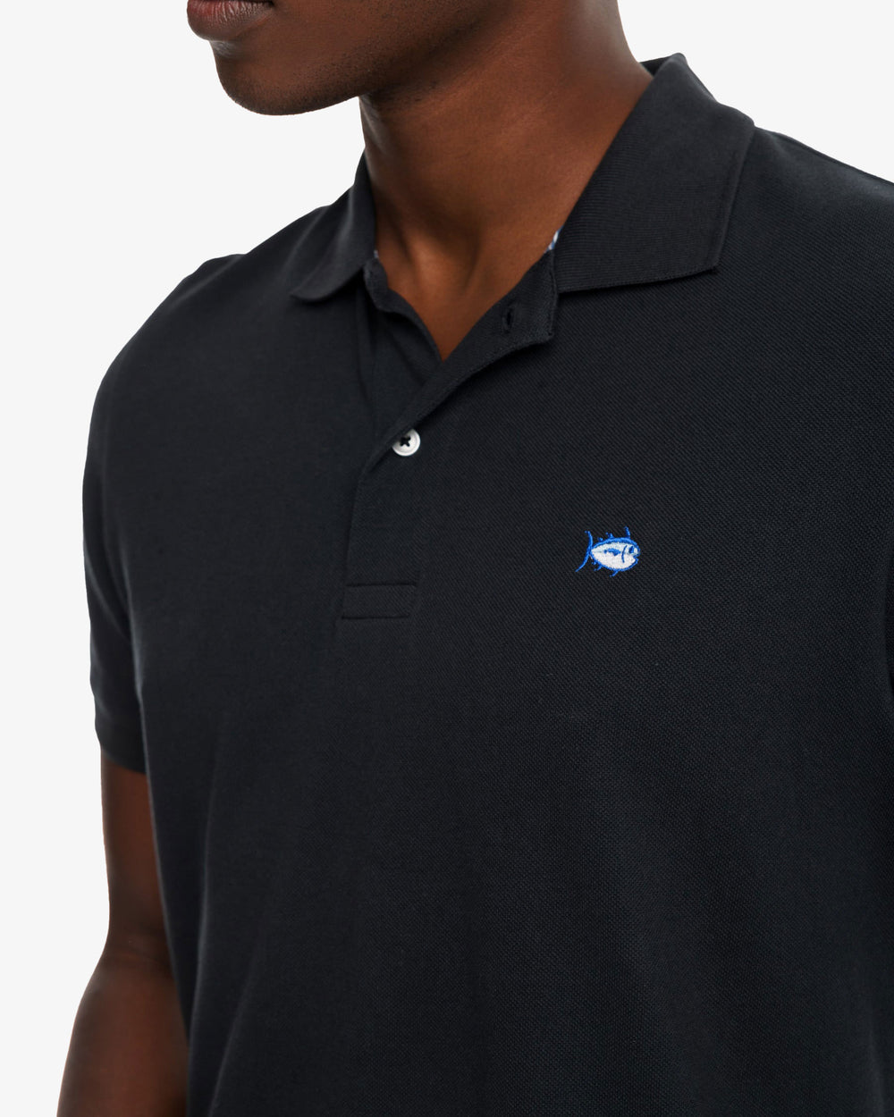 The model detail view of the Men's New Skipjack Polo Shirt by Southern Tide - Midnight Black