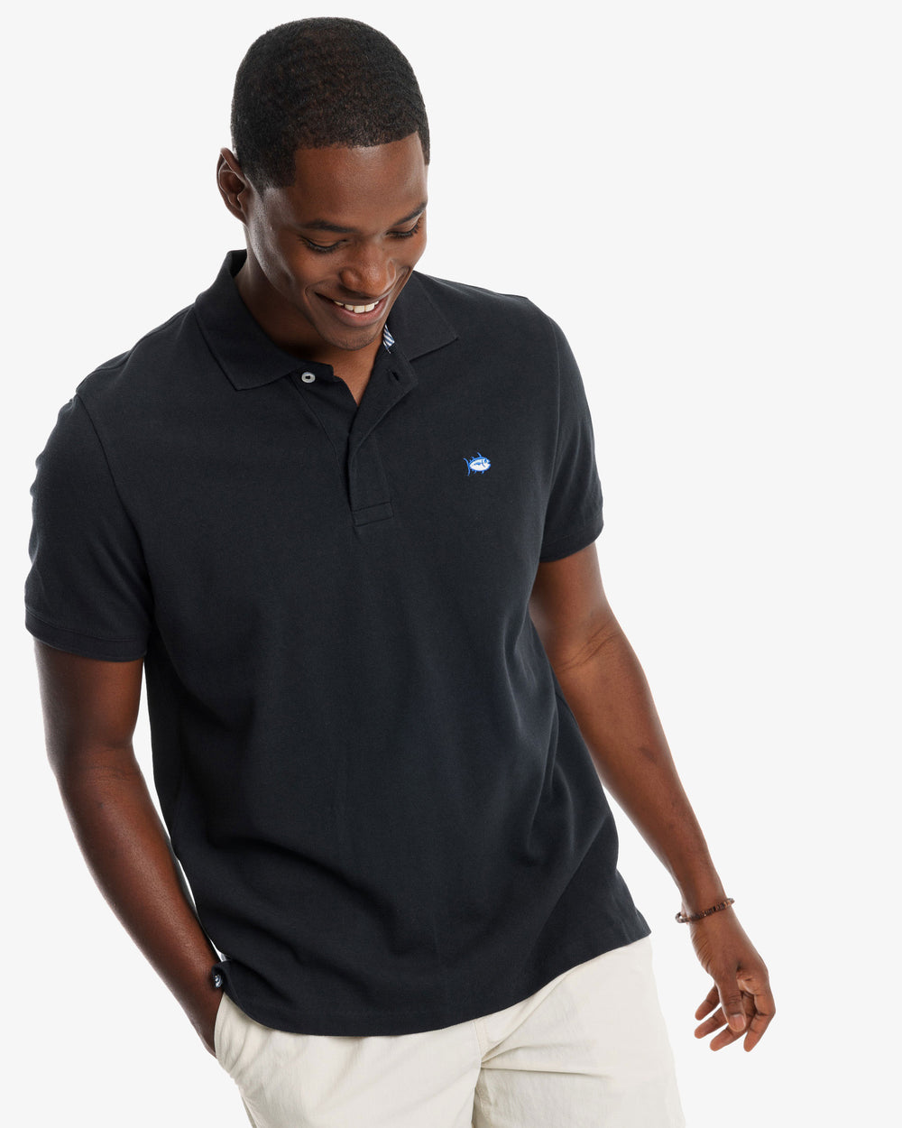 The model front view of the Men's New Skipjack Polo Shirt by Southern Tide - Midnight Black