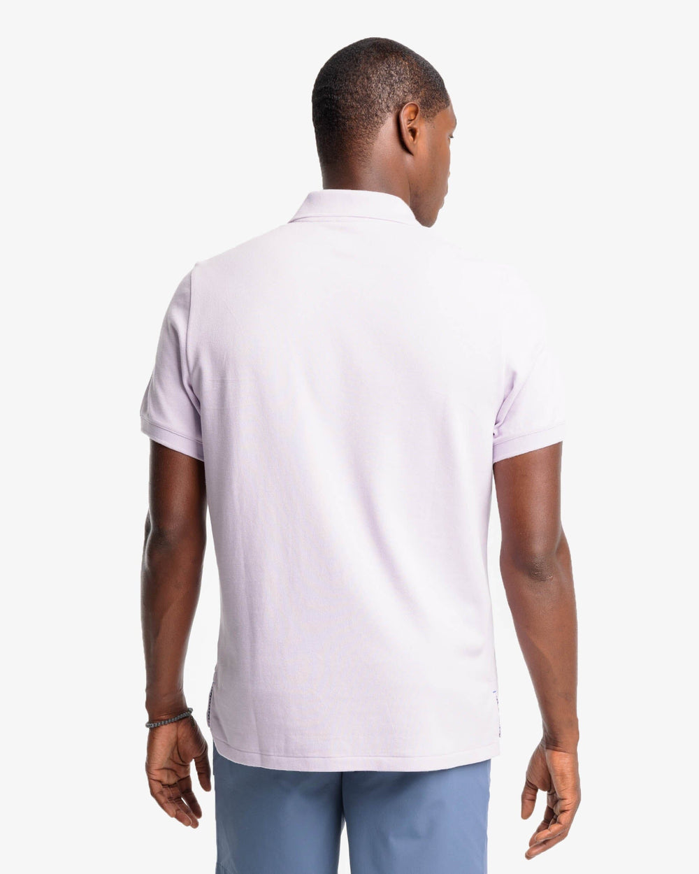 The model back view of the Men's New Skipjack Polo Shirt by Southern Tide - Orchid Petal
