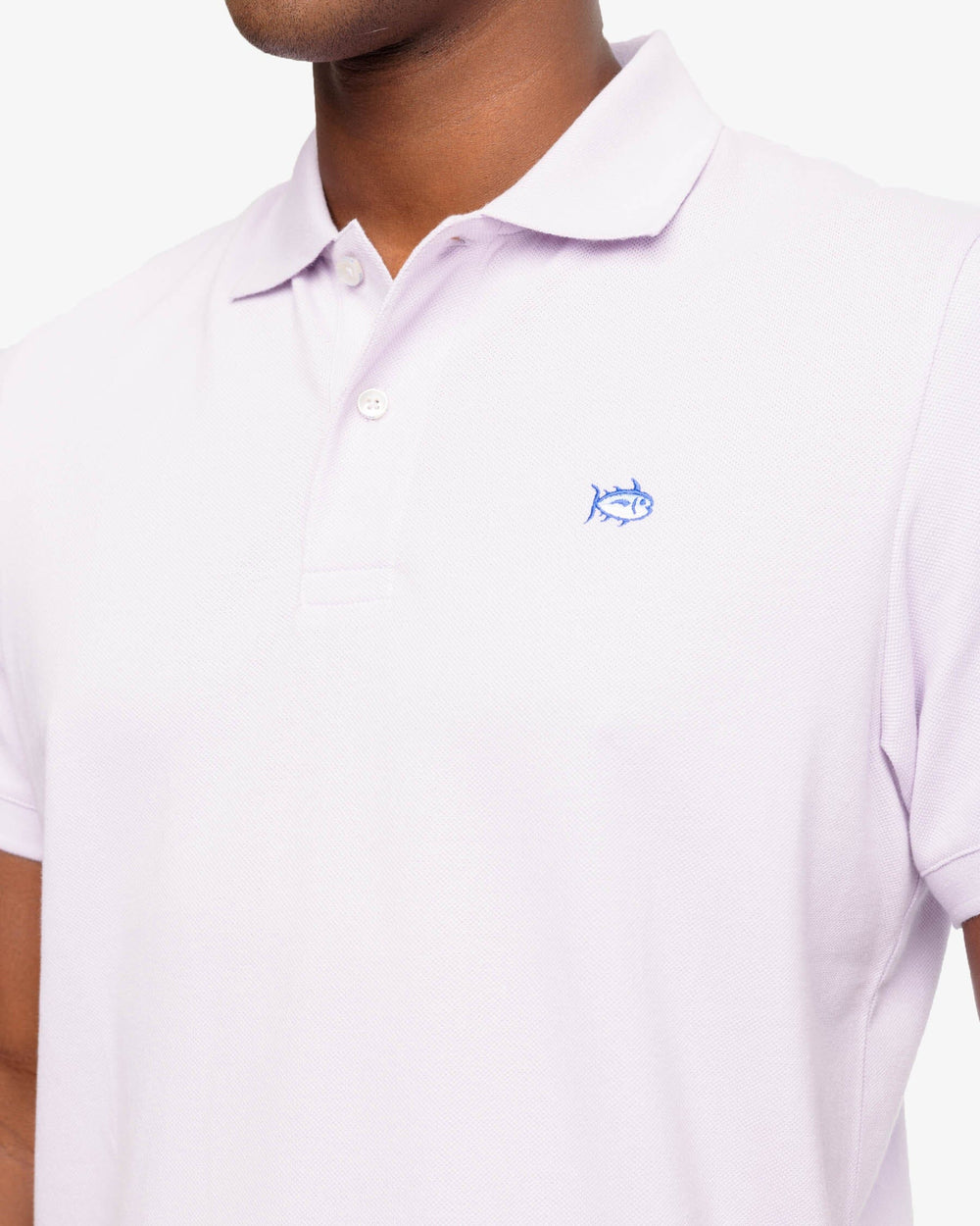 The model detail view of the Men's New Skipjack Polo Shirt by Southern Tide - Orchid Petal