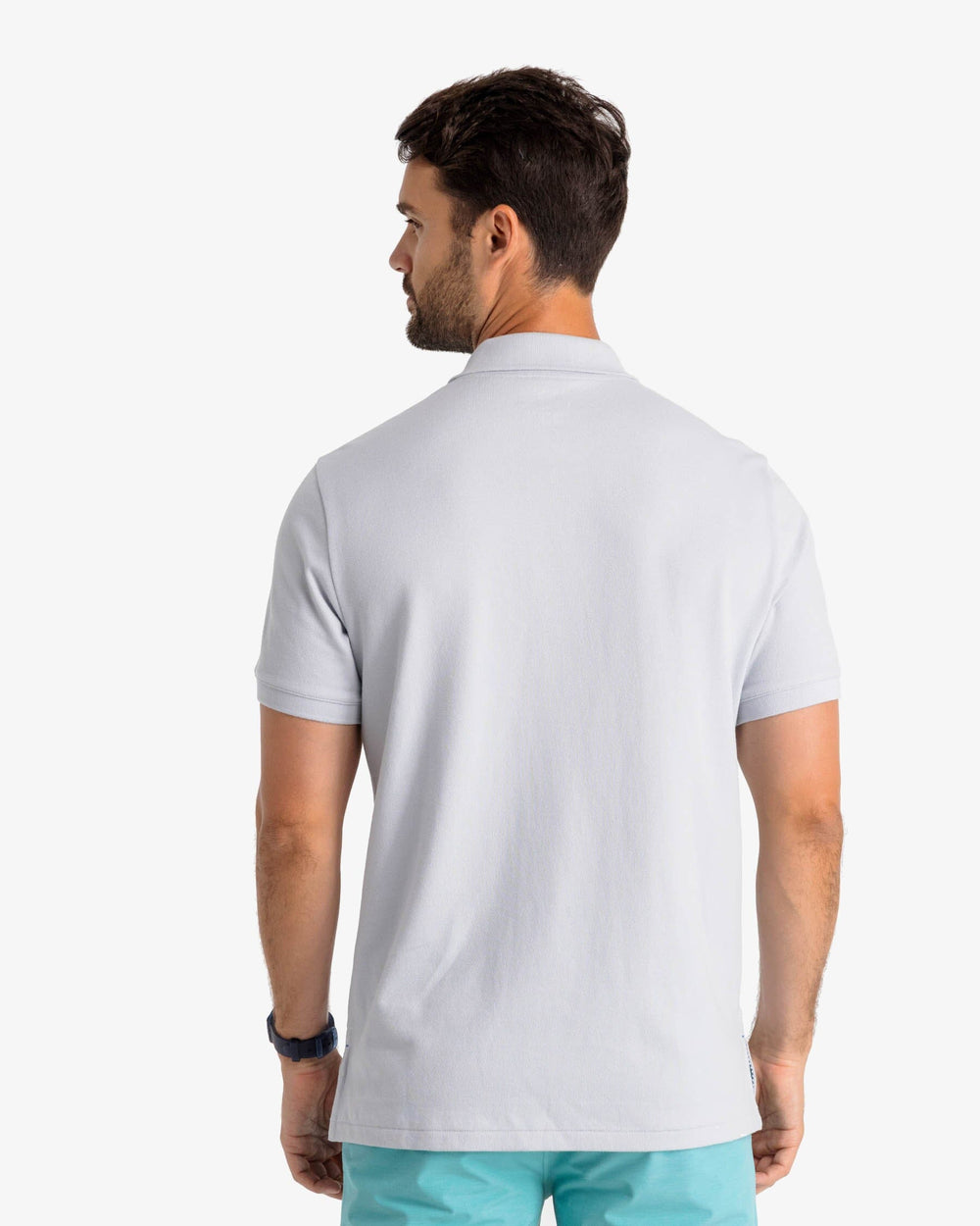The model back view of the Men's New Skipjack Polo Shirt by Southern Tide - Slate Grey