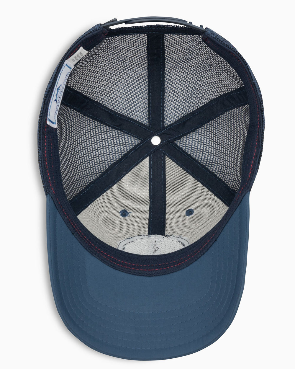 The below view of the Men's North Carolina Patch Performance Trucker Hat by Southern Tide - Seven Seas Blue