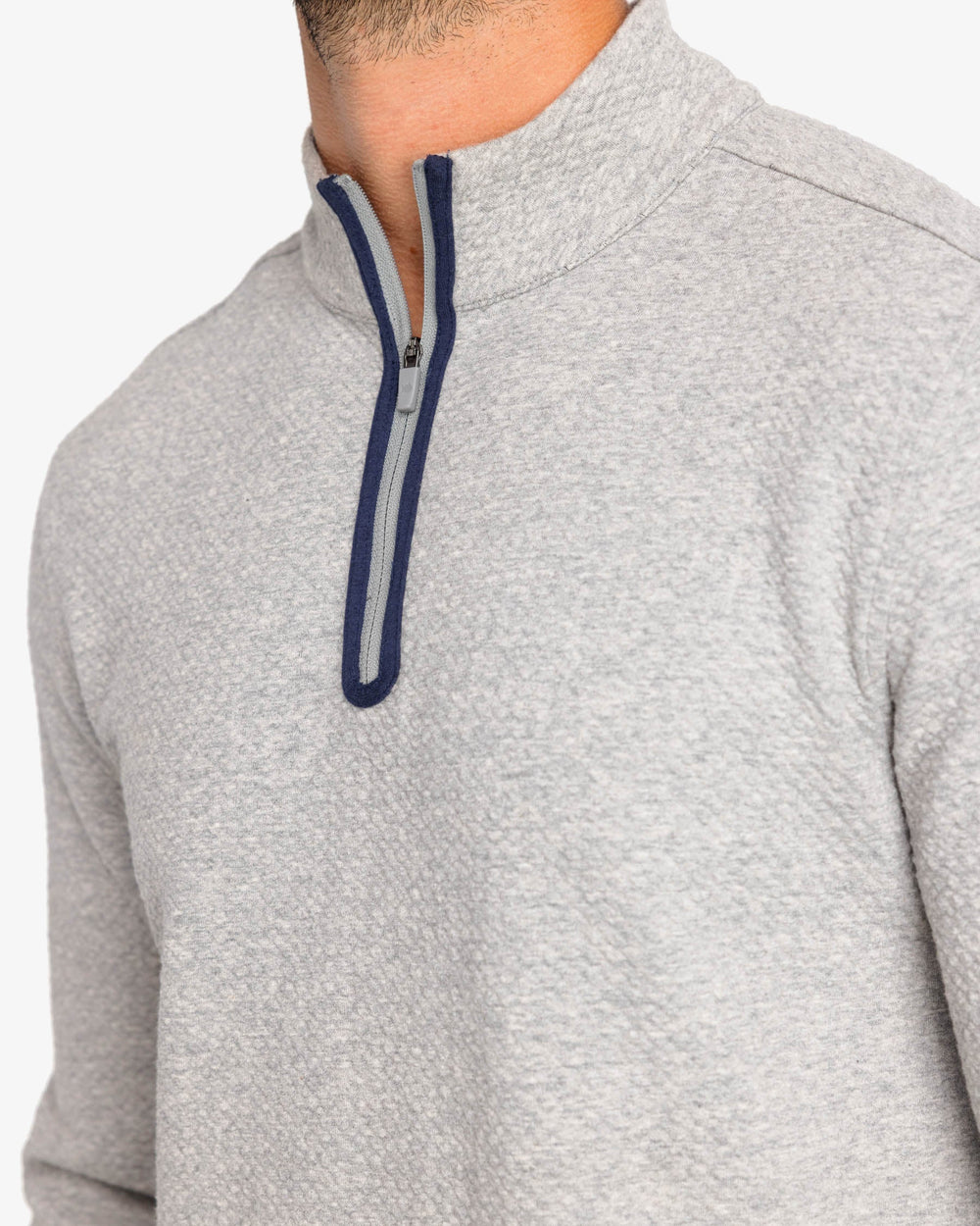 The detail view of the Outbound Quarter Zip Pullover by Southern Tide - Heather Mid Grey