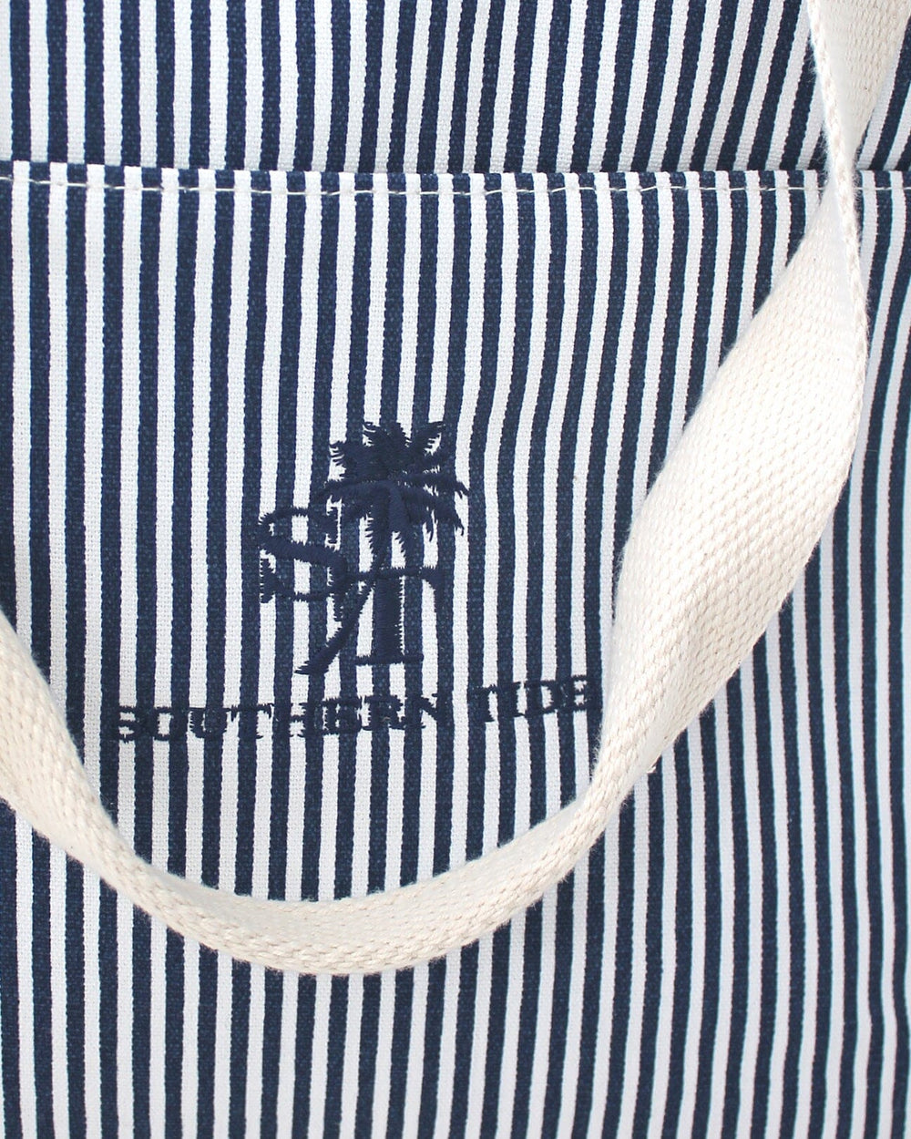 The detail view of the Palm Stripes Cooler by Southern Tide - Navy