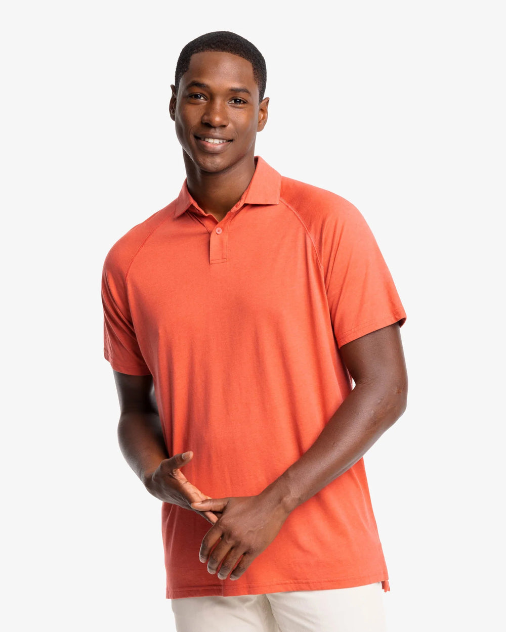 The front view of the Racquet Performance Polo Shirt by Southern Tide - Mineral Red