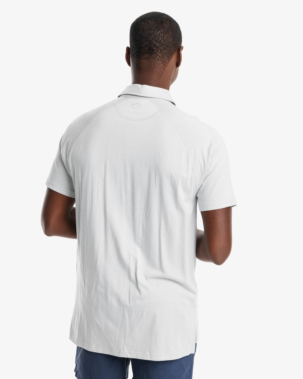 The model back view of the Men's Racquet Performance Polo Shirt by Southern Tide - Seagull Grey