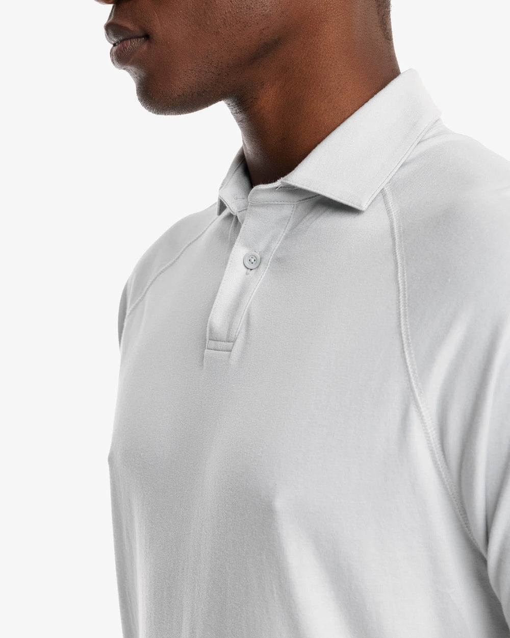 The model detail view of the Men's Racquet Performance Polo Shirt by Southern Tide - Seagull Grey