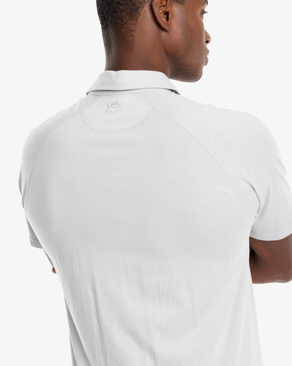 The model yoke view of the Men's Racquet Performance Polo Shirt by Southern Tide - Seagull Grey
