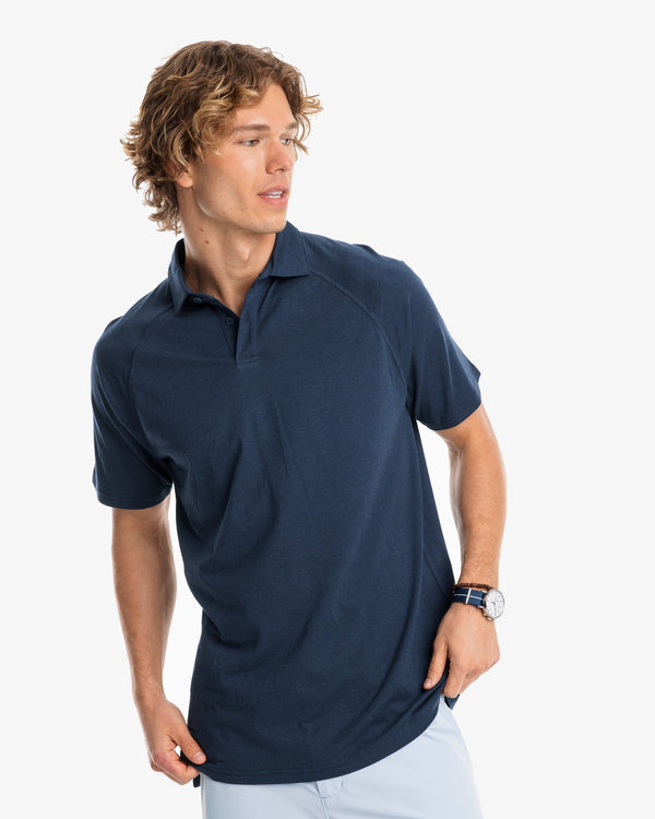 The model front view of the Men's Racquet Performance Polo Shirt by Southern Tide - True Navy