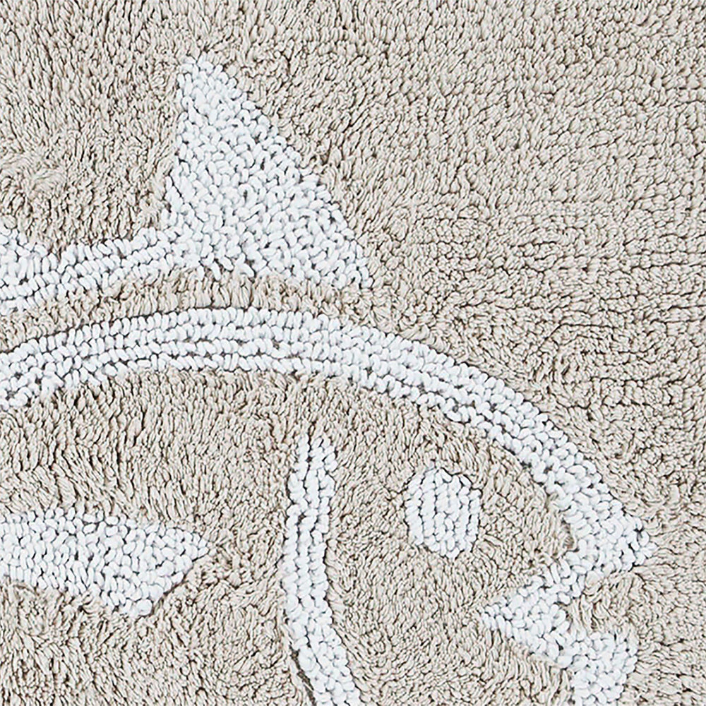 The detail view of the Reversible Skipjack Bath Rug by Southern Tide - Sand