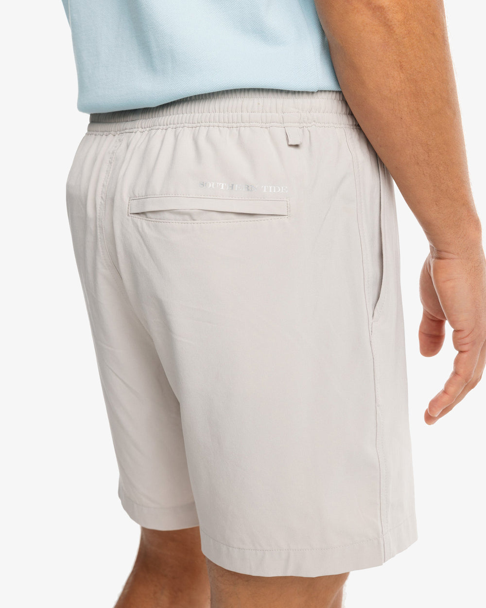 The model pocket view of the Men's Rip Channel 6 Inch Performance Short by Southern Tide - Marble Grey