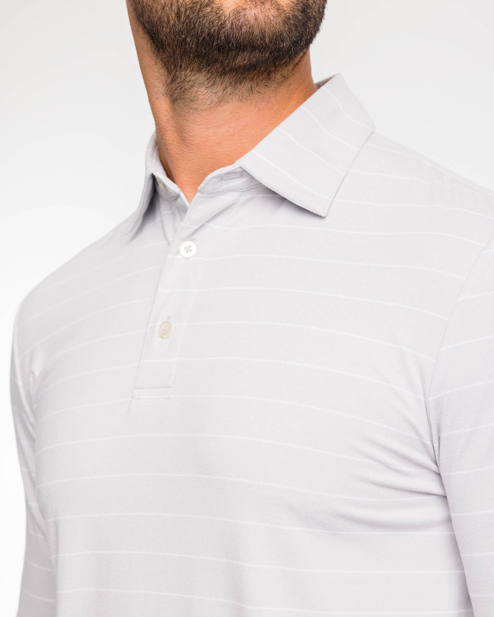 The detail view of the Ryder Bartlett Stripe Performance Polo Shirt by Southern Tide - Heather Seagull Grey