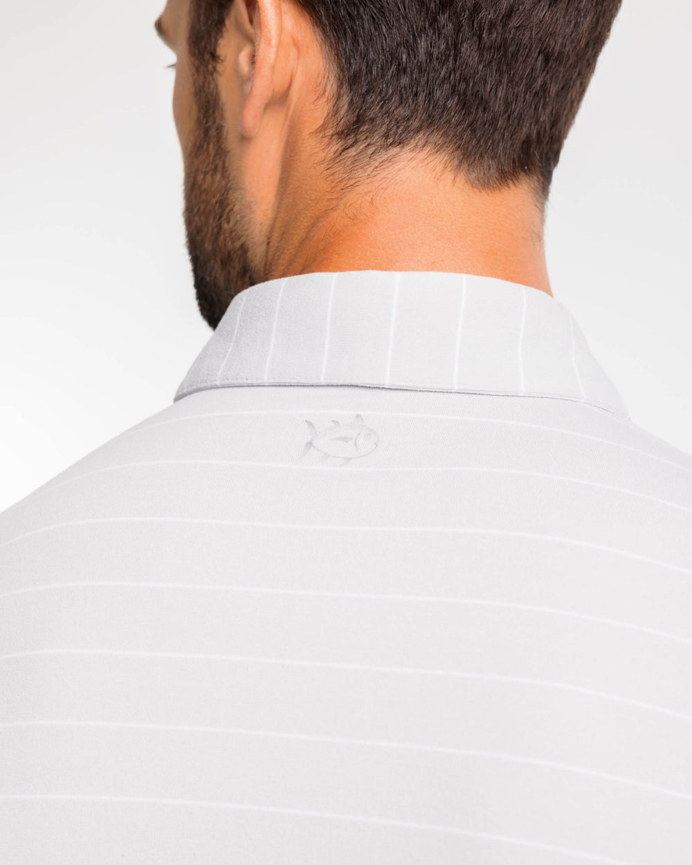 The back view of the Ryder Bartlett Stripe Performance Polo Shirt by Southern Tide - Heather Seagull Grey